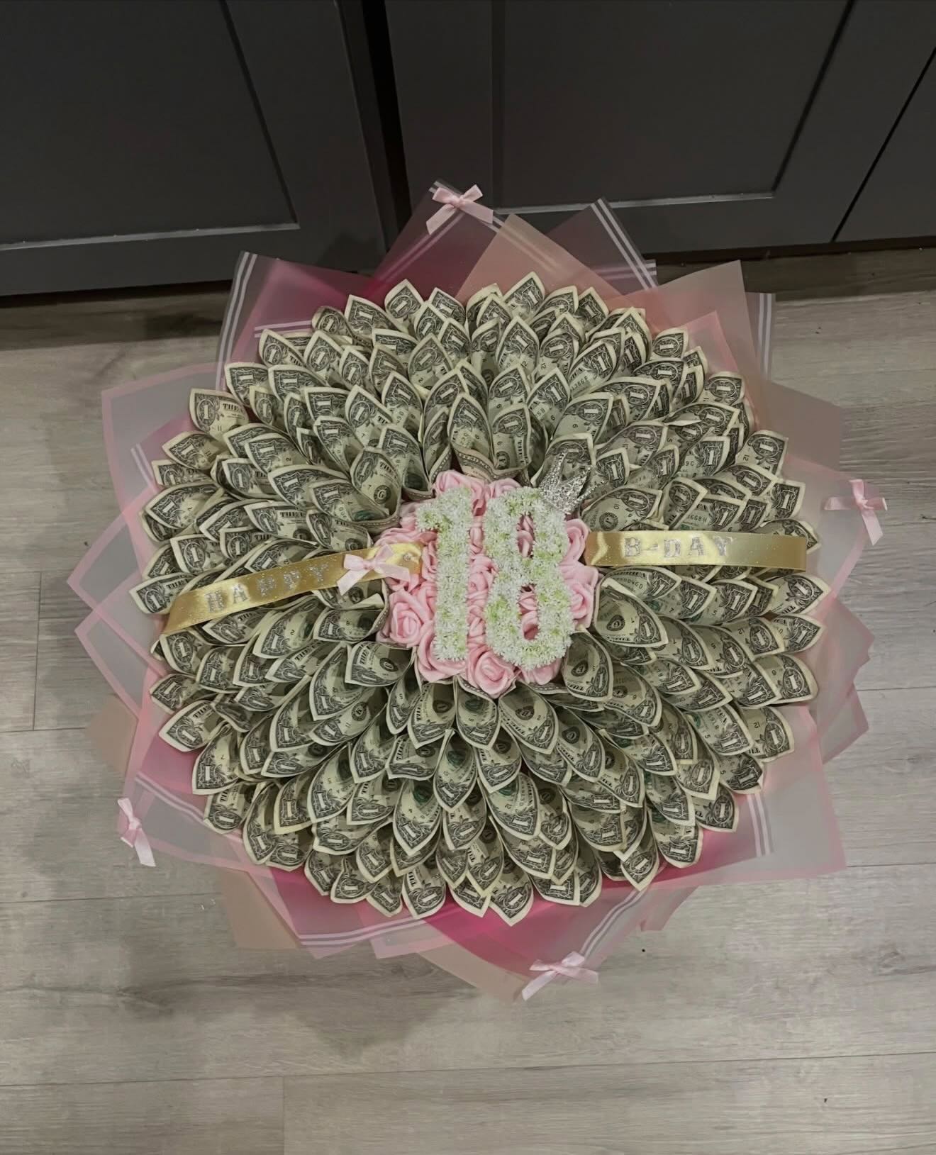 Money bouquet of folded dollar bills with a Happy 18 B-Day ribbon